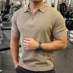 Man wearing a beige polo shirt in a gym setting